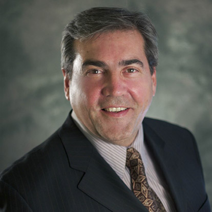 A headshot of Dr. David Dregner, a real estate agent with Park Regency Realty