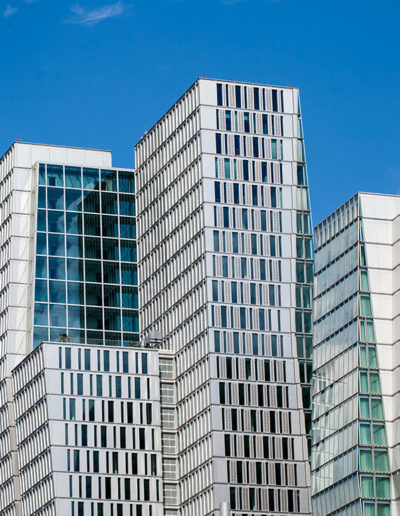 A tall office building with a blue sky in the background