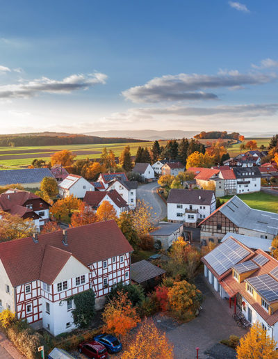 An aerial view of a small town in the fall
